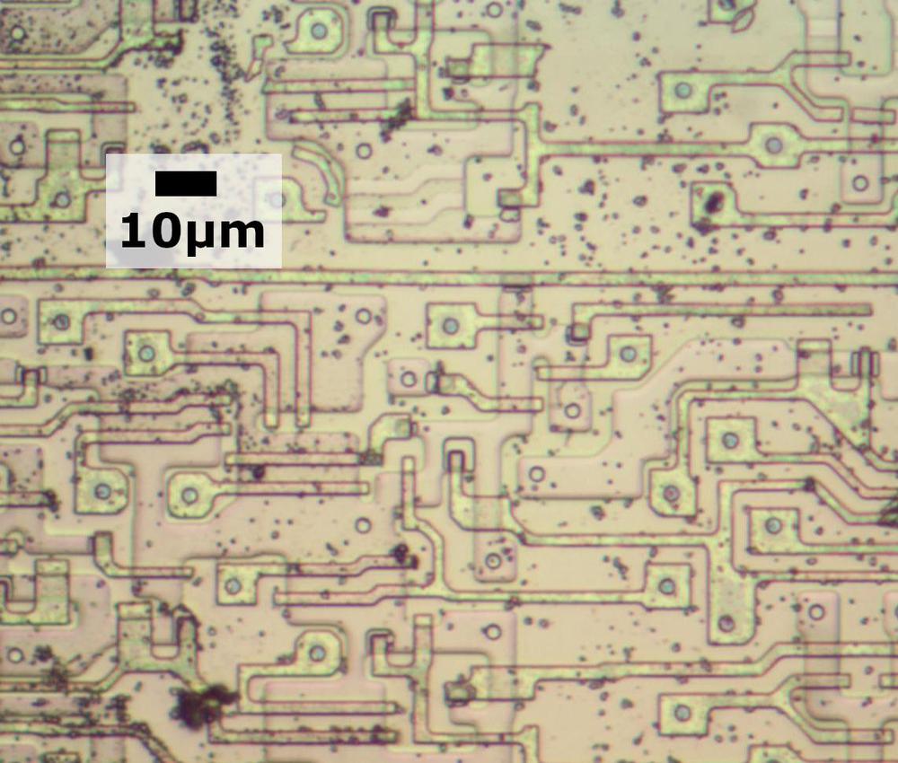 Transistors in the later 8086 chip. There are many vias between the silicon or polysilicon and the metal (which has been removed).