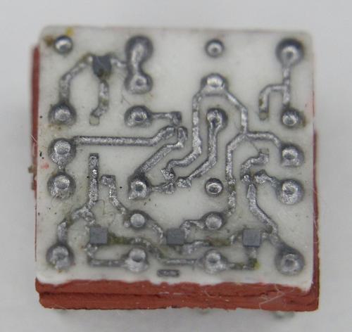 Closeup of an SLT module showing the tiny silicon dies mounted on the ceramic substrate.