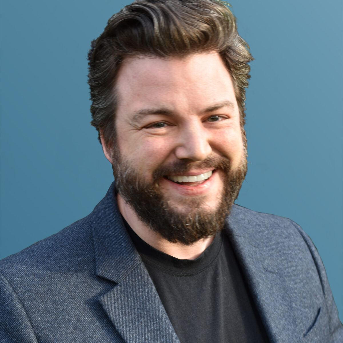 Kit Merker Headshot blazer gradient background sm
